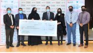 Officials from Lulu Hypermarket and Qatar Cancer Society during the fund hand over ceremony. 