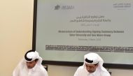 Dr. Hassan Al Derham (right), President of Qatar University, and Salem bin Saeed Al Muhannadi, CEO of Seashore Group, signing the MoU.