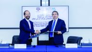 HBKU, TAMUQ officials exchanging the signed agreement.