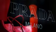 A handbag is seen behind a display window at a Prada store in Hong Kong June 3, 2011. REUTERS/Bobby Yip/File Photo