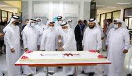 Secretary-General of QRCS Ali bin Hassan Al Hammadi and other dignitaries cutting a cake to mark 44th anniversary of QRCS.