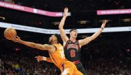 Phoenix Suns guard Cameron Payne (15) goes up for a layup against Chicago Bulls guard Alex Caruso (6) during the second half at Footprint Center. Joe Camporeale