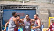 Qatar players celebrate during the Asian Beach Handball Championship.