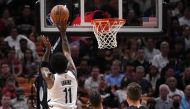 Brooklyn Nets guard Kyrie Irving (11) puts up a shot against the Miami Heat during the first half at FTX Arena. Jasen Vinlove