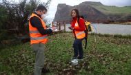 Vittoreo Zanon and Fatima Viveiros monitor soil gases in Rosais near Velas as small earthquakes have been recorded in Sao Jorge island, Azores, Portugal, March 27, 2022. REUTERS/Pedro Nunes
