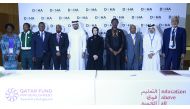 Minister of Education and Higher Education H E Buthaina bint Ali Al Jabr Al Nuaimi and Director-General of QFFD H E Khalifa Al Kuwari with other officials during the signing ceremony at Doha Forum. PIC: RAJAN VADAKKEMURIYIL