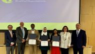 Officials with winners of the 3MT competition during an honouring ceremony.