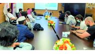 Qatar University students with a Boeing official during a meeting. 