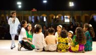 Children enjoy as they play traditional games at Katara.