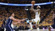 Utah Jazz guard Jordan Clarkson (00) shoots the ball against Dallas Mavericks center Dwight Powell (7) during the third quarter in game four of the first round for the 2022 NBA playoffs at Vivint Arena. Utah Jazz won 100-00.Chris Nicoll