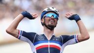 September 26, 2021 France's Julian Alaphilippe celebrates as he crosses the line to win the race REUTERS/Yves Herman
