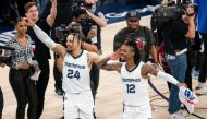 Memphis Grizzlies forward Dillon Brooks (24) and guard Ja Morant (12) celebrate after the game against the Minnesota Timberwolves after game six of the first round for the 2022 NBA playoffs at Target Center. Mandatory Credit: Brad Rempel
