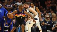 Phoenix Suns guard Chris Paul (3) moves the ball against Dallas Mavericks guard Luka Doncic (77) during the second half in game two of the second round for the 2022 NBA playoffs at Footprint Center. Mark J. Rebilas