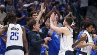 Dallas Mavericks guard Luka Doncic (77) celebrates with owner Mark Cuban and teammates after leaving the game during the fourth quarter against the Phoenix Suns in game three of the second round of the 2022 NBA playoffs at American Airlines Center.  Kevin Jairaj