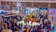 Visitors enjoy a performance to celebrate Eid Al Fitr at Hyatt Plaza mall.  