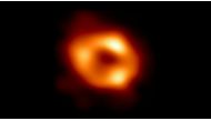 This is the first image of Sagittarius A* (or Sgr A* for short), the supermassive black hole at the center of our galaxy. It was captured by the Event Horizon Telescope (EHT), an array which linked together radio observatories across the planet to form a single 