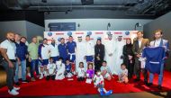 Paris Saint-Germain (PSG) players with Ooredoo officials and fans.