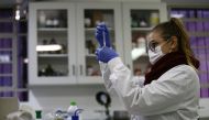 A researcher analyzes samples for a study that points out that a compound found in fruits can neutralize the poison of the jararaca snake, at Butantan Institute, in Sao Paulo, Brazil May 18, 2022. Picture taken May 18, 2022. REUTERS/Carla Carniel