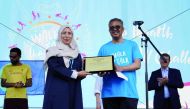 Minister of Public Health H E Dr. Hanan Mohamed Al Kuwari receiving the award from WHO Director-General Dr Tedros Adhanom Ghebreyesus in Geneva, yesterday. 