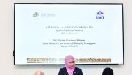 Prof. Mariam Al Maadeed, Vice-President for Research and Graduate Studies at QU, and Prof. Dr. Dato Mazlan Abd. Ghaffar, Vice-Chancellor of UMT, sign the MoU.