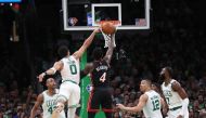 Miami Heat guard Victor Oladipo (4) goes to the basket defended by Boston Celtics forward Jayson Tatum (0) in the second half during game four of the 2022 eastern conference finals at TD Garden.Paul Rutherford