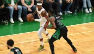 Miami Heat forward Jimmy Butler (22) controls the ball against Boston Celtics guard Marcus Smart (36) during the second half in game six of the 2022 eastern conference finals at TD Garden. Brian Fluharty
