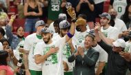 Boston Celtics forward Jayson Tatum (0) reacts after winning the Larry Bird Eastern Conference Finals MVP trophy after game seven of the 2022 eastern conference finals at FTX Arena. Jim Rassol
