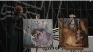 Mariya Medvedeva shows some of her artworks during the “Unravel” concert.