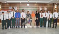 Principal of Pakistan International School Qatar (PISQ), Nargis Raza Otho, with debaters and their coach during a felicitation ceremony.