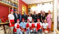 Officials and staff from Juan Valdez and Ali Bin Ali Hospitality, at the cafe’s branch in Katara Cultural Village, recently. 