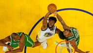 Golden State Warriors forward Andrew Wiggins (22) goes for a rebound against Boston Celtics guard Marcus Smart (36) and center Al Horford (42) during game two of the 2022 NBA Finals at Chase Center. Ezra Shaw