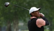 FILE PHOTO: Tiger Woods plays his shot from the ninth tee as rain falls during the third round of the PGA Championship golf tournament at Southern Hills Country Club. Mandatory Credit: Michael Madrid-USA TODAY Sports/File Photo
