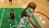 Boston Celtics guard Jaylen Brown (7) dunks and scores against the Golden State Warriors in the second half during game three of the 2022 NBA Finals at TD Garden.  Kyle Terada