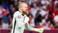 Australia’s Andrew Redmayne celebrates after saving a penalty during the shootout.