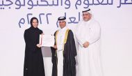 Minister of Education and Higher Education H E Buthaina bint Ali Al Jabr Al Nuaimi presenting graduation certificate to a QSTSS graduate. 