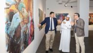 Katara General Manager, Prof. Dr. Khalid bin Ibrahim Al Sulaiti (center), Georgian Ambassador to Qatar, H E Nikoloz Revazishvili (left), and Georgian artist Gela Patiashvili (right), during the opening of “Forms of Life” art exhibition at Katara.