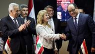 Director-General of Oil Facilities at Lebanese Energy Ministry Aurore Feghali shakes hands with Chairman of the Egyptian Natural Gas Holding Company (EGAS) Magdy Galal after they signed gas import agreement, at the energy ministry in Beirut, Lebanon June 21, 2022. REUTERS/Mohamed Azakir