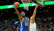 Golden State Warriors forward Andrew Wiggins (22) shoots the ball against Boston Celtics forward Grant Williams (12) during the second quarter in game six of the 2022 NBA Finals at TD Garden. Mandatory Credit: Kyle Terada-USA TODAY Sports/File Photo