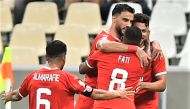 Mehrdad Mohammadi celebrates with team-mates. Picture: Abdul Basit / The Peninsula