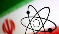 The atomic symbol and the Iranian flag are seen in this illustration, July 21, 2022. REUTERS/Dado Ruvic/Illustration/File Photo


