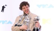 Jack Harlow poses backstage with his awards at the 2022 MTV Video Music Awards at the Prudential Center in Newark, New Jersey, U.S., August 28, 2022. Reuters/Caitlin Ochs