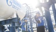 Employees work at the Alexander Zhagrin oilfield operated by Gazprom Neft in Khanty-Mansi Autonomous Area-Yugra, Russia, in this picture released August 30, 2022. (Stoyan Vassev/Press service of Gazprom Neft via Reuters)