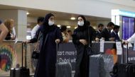 FILE PHOTO: Travellers at the Dubai International Airport, in Dubai, United Arab Emirates January 29, 2020. REUTERS/Christopher Pike
