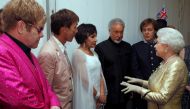 Queen Elizabeth meets singers Elton John, Cliff Richard, Shirley Bassey, Tom Jones and Paul McCartney (L-R) backstage at the Diamond Jubilee Concert outside Buckingham Palace in London June 4 , 2012. REUTERS/Dave Thompson/POOL/File Photo