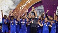 Al Hilal players celebrate winning the Lusail Super Cup with the trophy. REUTERS/Ibraheem Al Omari