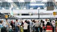 People wait in lines at Schiphol Airport in Amsterdam, Netherlands June 16, 2022. REUTERS/Piroschka van de Wouw/File Photo