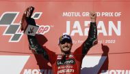 September 25, 2022 Ducati Lenovo's Jack Miller lifts the trophy as he celebrates on the podium after winning the race REUTERS/Issei Kato