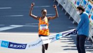 Brigid Kosgei of Kenya crosses the line to win the women's elite race at the Tokyo Marathon 2021 in Tokyo, Japan, on March 6, 2022. (REUTERS/Kim Kyung-Hoon)