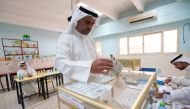 A man votes during parliamentary elections at a polling station in Kuwait City, Kuwait September 29, 2022. REUTERS/Stephanie McGehee