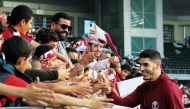 Qatar's Karim Boudiaf signs autographs for fans. Pics: Salim Matramkot